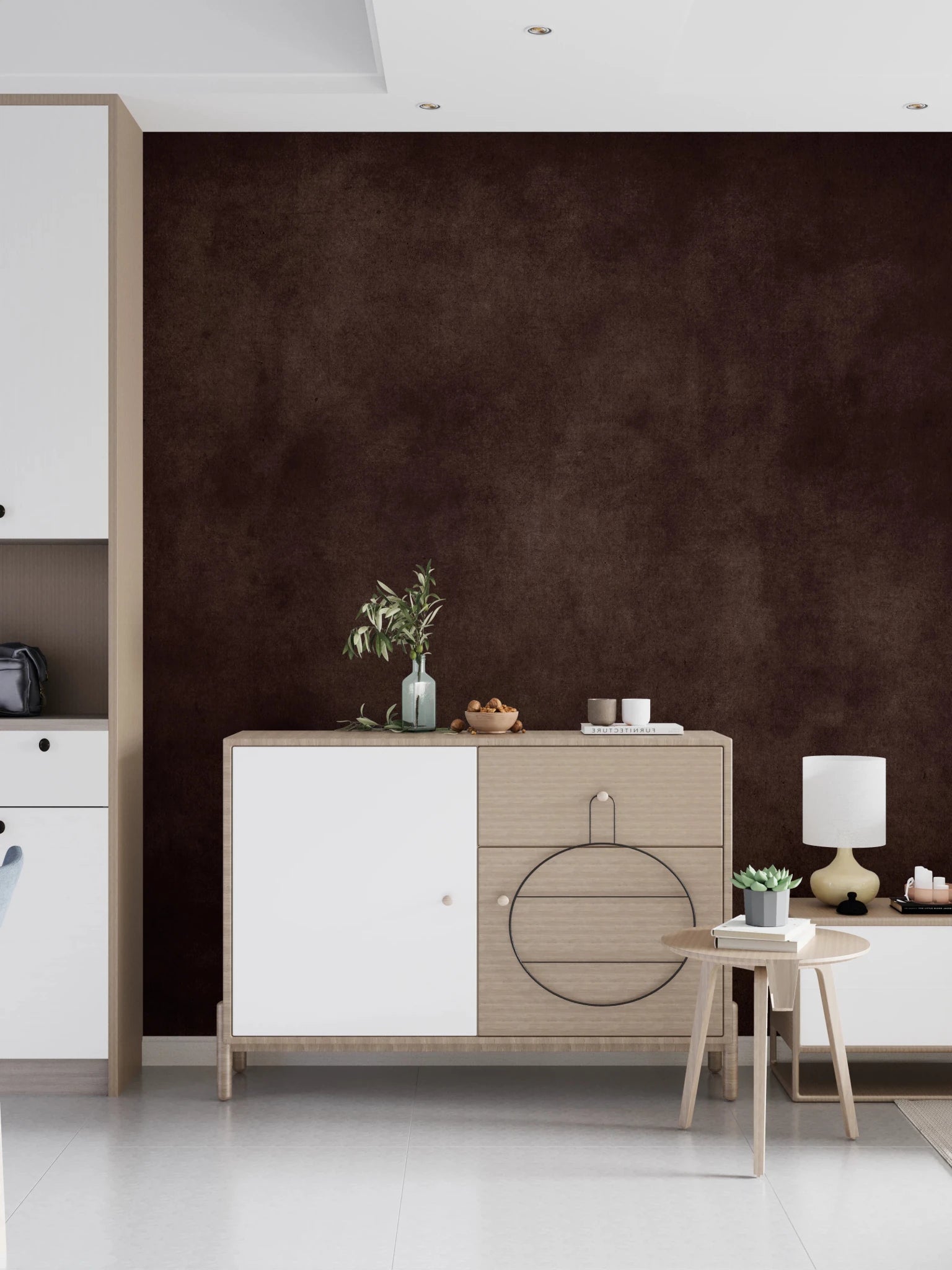 Dirty Paper Cognac wall mural in cognac brown behind a white and oak sideboard with olive sprig and lamp