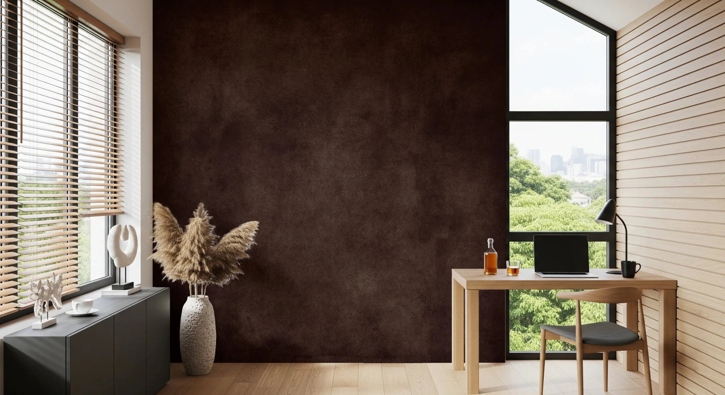 Dirty Paper Cognac wall mural in a home office with light wood desk, chair and pampas grass by a city-view window