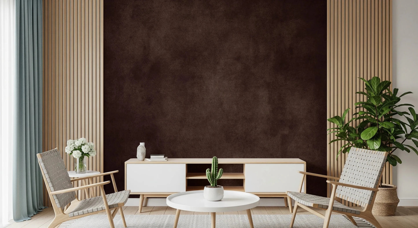 Dirty Paper Cognac wall mural in deep brown behind a white TV unit with cactus, framed by wood slat walls