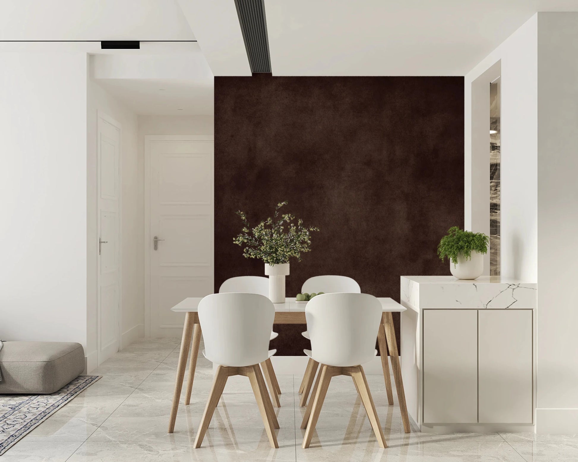 Dirty Paper Cognac wall mural in rich brown behind a white dining table and chairs beside a marble counter