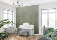 Ombre Sage wall mural in a music room with white upright piano, grey bench and chandelier