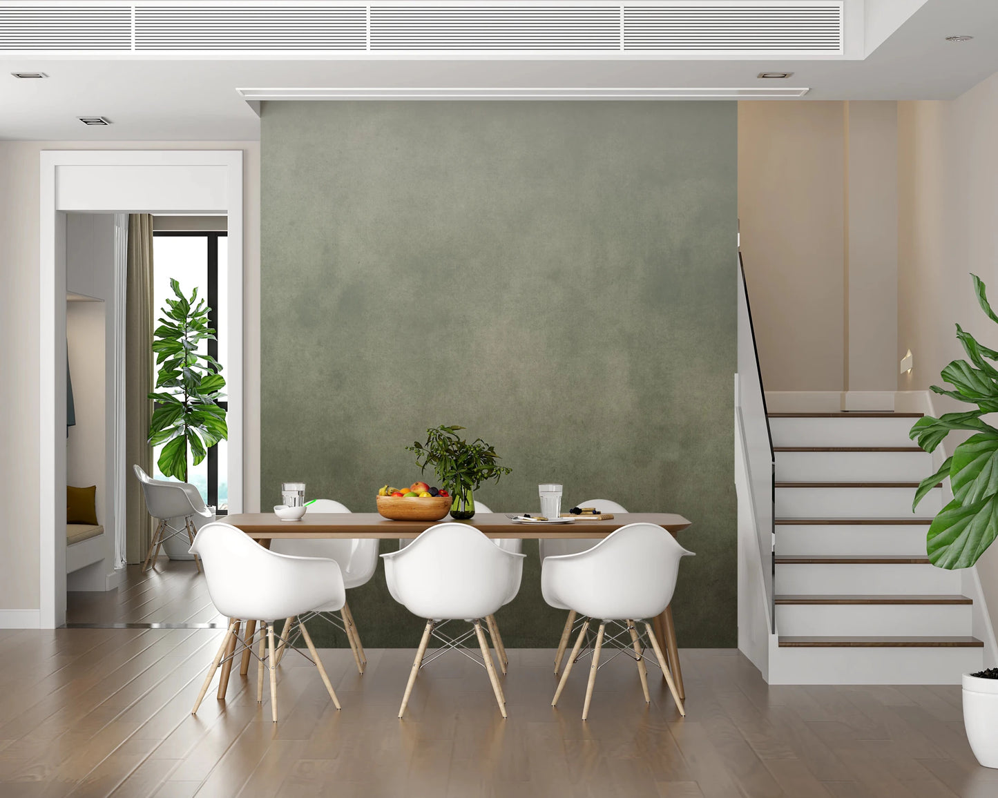 Ombre Sage wall mural in a dining room with wood table, white Eames chairs and a staircase