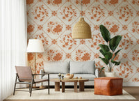 Vintage floral square pattern wallpaper behind bed in bedroom, soft beige and green tones