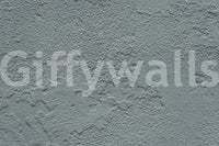 Distressed Walls wallpaper mural close-up showing rough grey-green plaster with subtle cracks and peeling detail