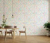 Small multicolor blossoms on a white wallpaper

