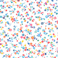 Ditsy Minimal Tiny Flowers Multicolor wallpaper close-up showing scattered tiny blossoms on a white ground