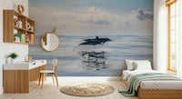 Dolphin wallpaper mural in reading nook, ocean-inspired wall decor, modern apartment style
