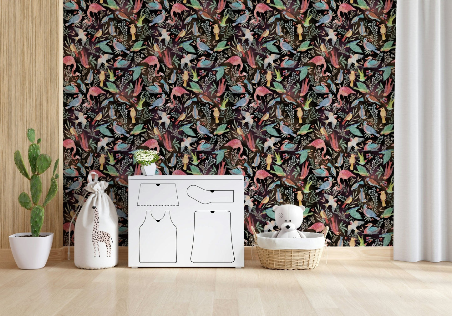 Dream Dark Birdwatcher's wallpaper of birds and foliage in a kids room with a white dresser and teddy basket