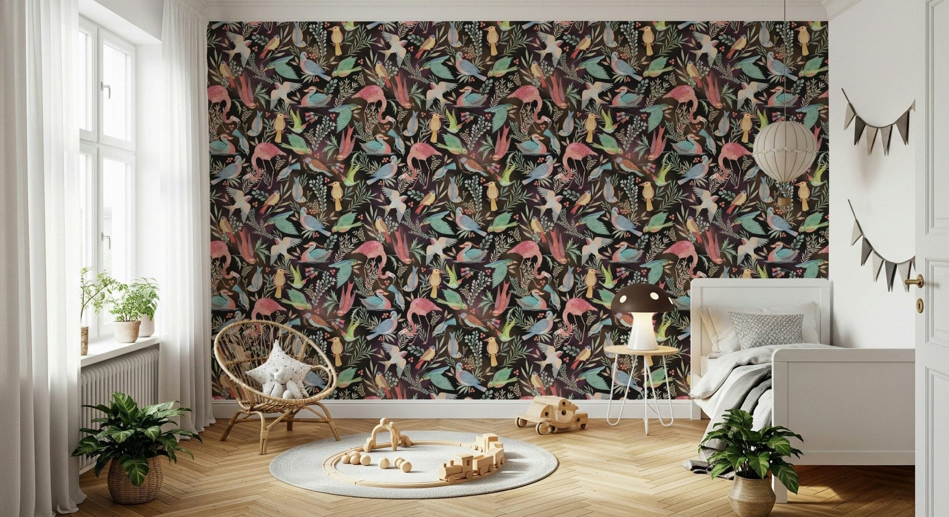 Dream Dark Birdwatcher's wallpaper of birds on black in a kids room with a rattan chair and wooden train toys