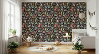 Dream Dark Birdwatcher's wallpaper of birds on black in a kids room with a rattan chair and wooden train toys