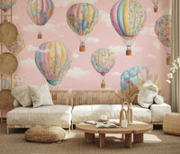Playful sky-themed mural with hot air balloons drifting through a dreamy, painterly horizon.