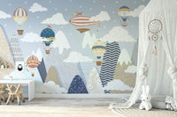 The design features hot air balloons and clouds.

