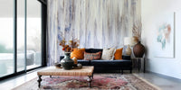 Textured wall mural with flowing drip patterns creating a peaceful, artistic accent wall.