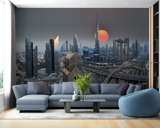 Dubai Skyline During Sunrise wallpaper mural with orange sun behind a blue sectional sofa in a living room