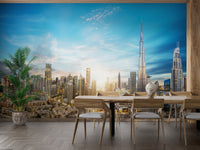 Dubai Skyline Panoramic wallpaper mural styled as a living room feature wall behind a sofa and seating in blue tones