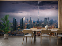 Dubai Skyline wallpaper mural of a stormy dusk cityscape behind a wood dining table and palm plant