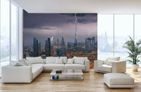 Dubai Skyline wallpaper mural with lightning over the Burj Khalifa behind a white sectional sofa
