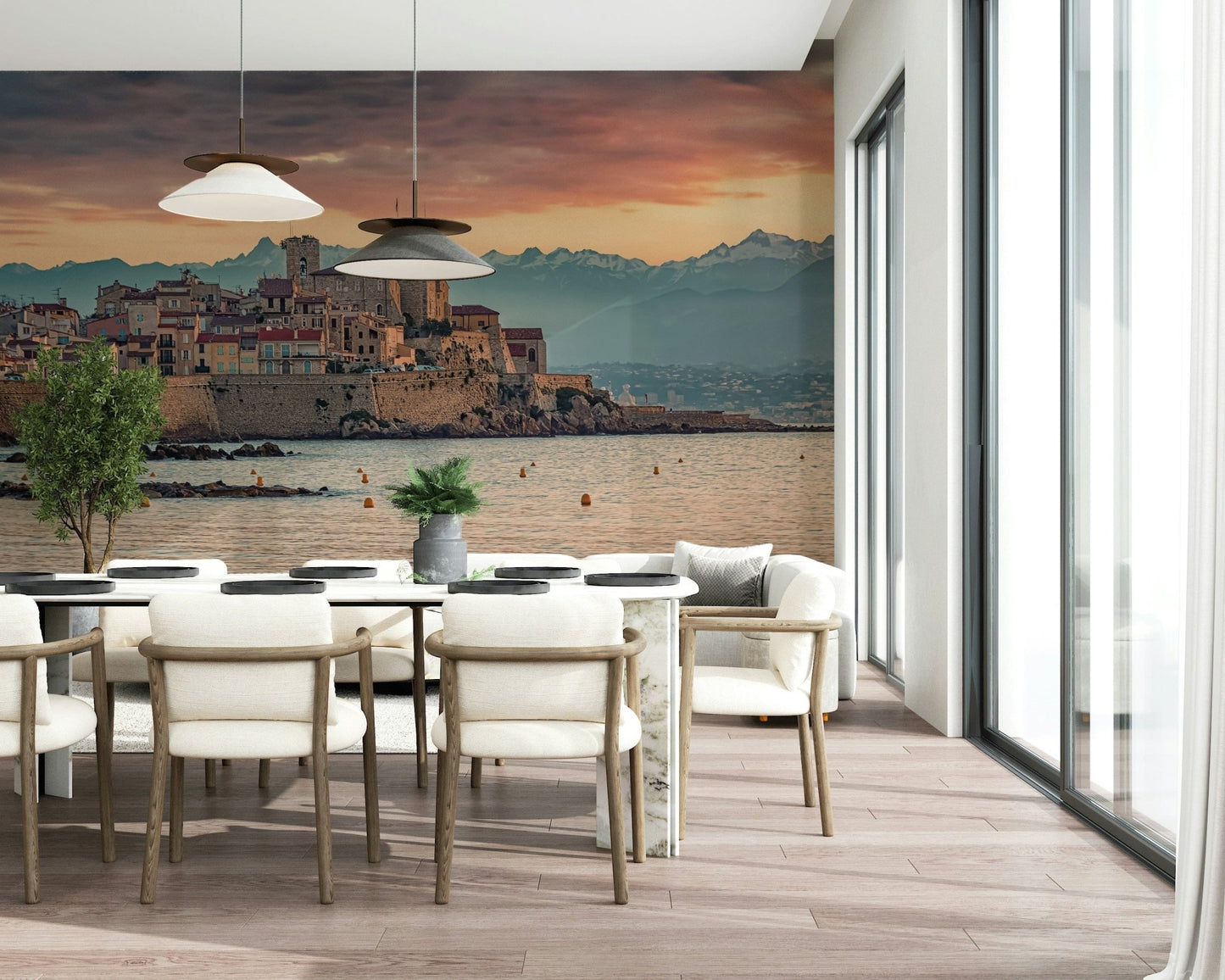 Wall mural depicting Antibes’ waterfront and ancient stone walls beneath a dramatic sunset sky.