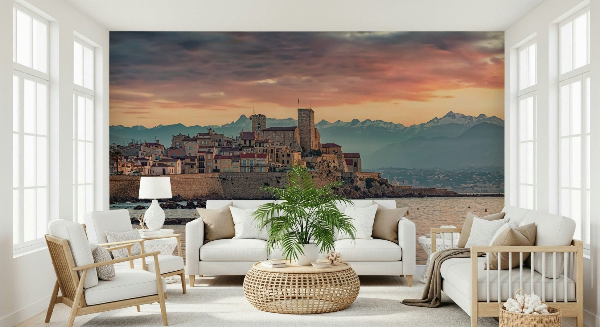 Historic town mural featuring Antibes bathed in evening light with calm sea in the foreground.
