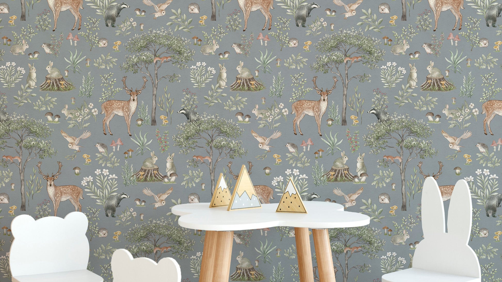 Dusty Blue Wildlife wallpaper with deer and owls behind a white cloud table with bear and bunny chairs
