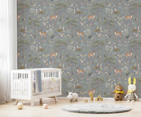 Dusty Blue Wildlife wallpaper in a nursery with a white crib, teddy bear and bunny plush toys