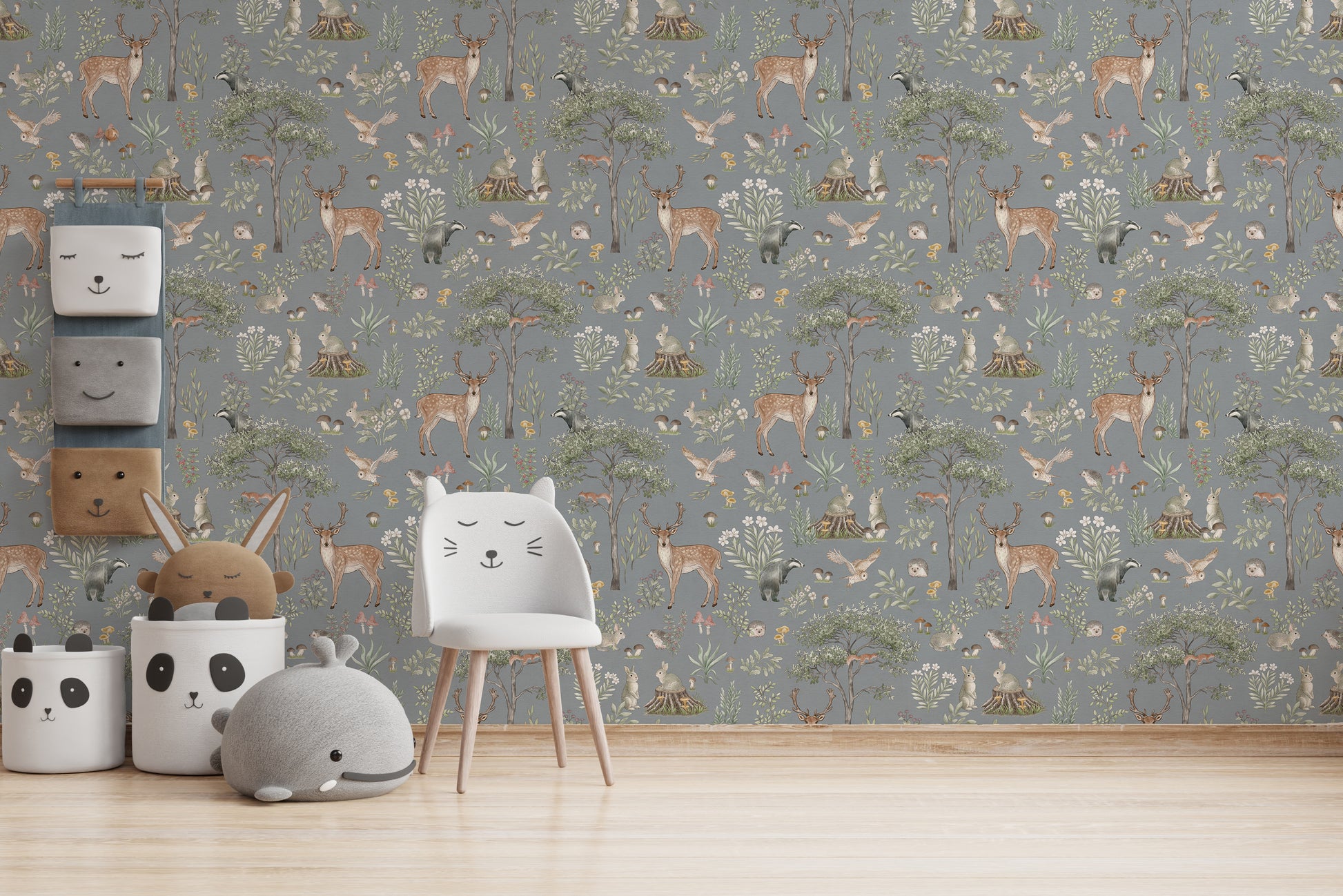 Dusty Blue Wildlife wallpaper with a white cat-ear chair, panda baskets and a grey whale cushion
