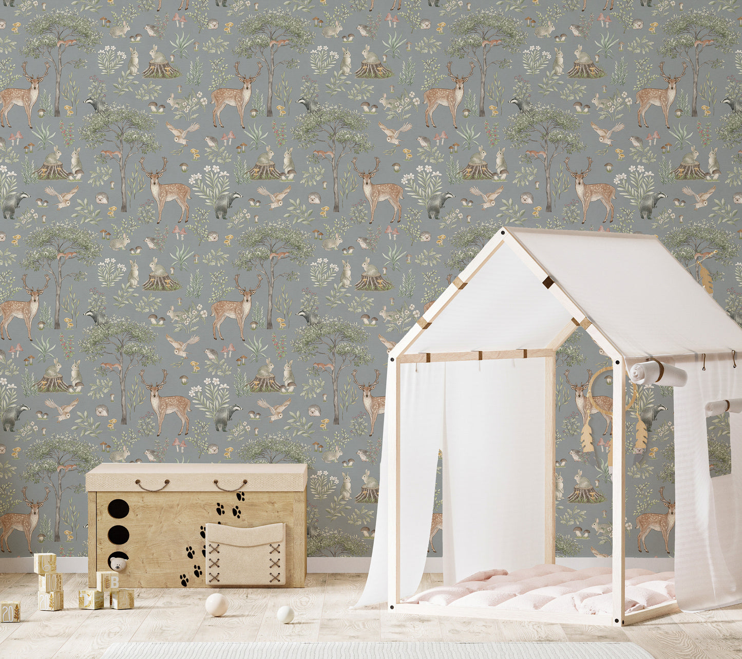 Dusty Blue Wildlife wallpaper in a kids room with a white house-frame bed and wooden toy chest