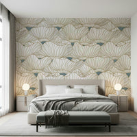 Dusty White Botanical Bloom Waves wallpaper with gold line lotus blooms behind a beige bed with twin globe lamps