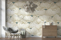Dusty White Botanical Bloom Waves wallpaper behind a grey accent chair and light wood dresser with a cluster pendant