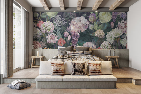 Dutch Roses Floral wallpaper mural with pink and white blooms on dark green behind a bed in a beamed bedroom