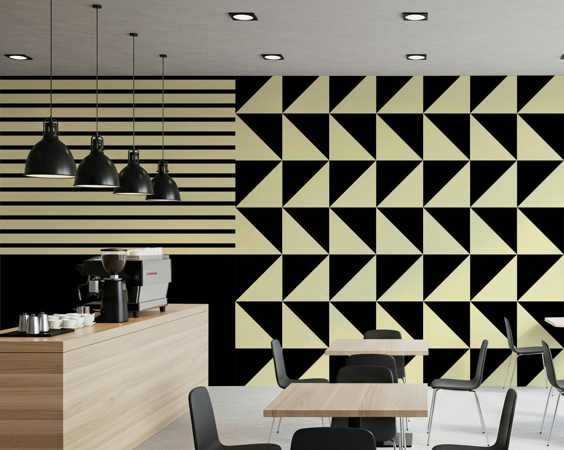 Dynamic Duo Shapes wall mural in black and cream stripes and triangles behind a cafe counter and dining tables