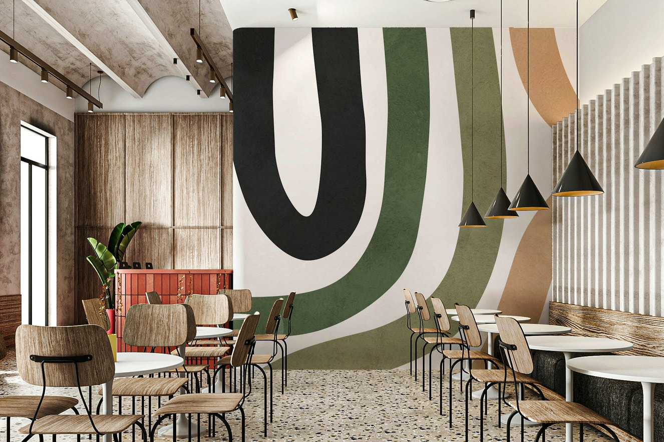 An abstract wall mural with flowing, curved shapes.

