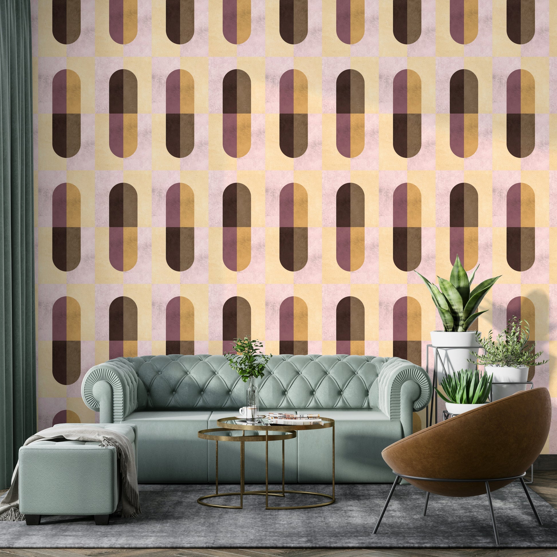 Earthy Geometric wallpaper in warm hues behind a mint-green velvet chesterfield sofa and leather chair