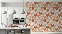 Repeating organic heart shapes in soft earthy colors create a gentle, modern wallpaper.