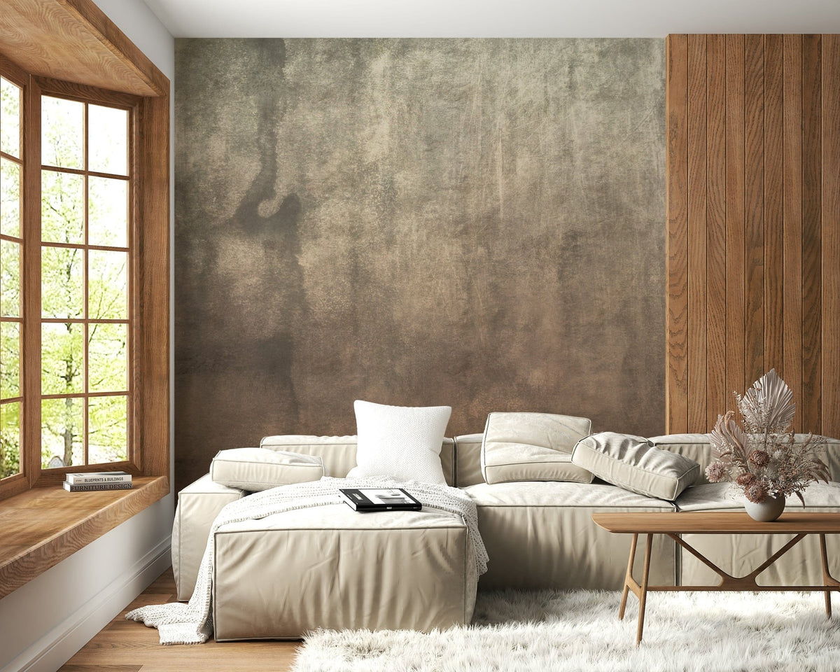 Earthy Textured Watercolour Mushroom wallpaper mural in mottled taupe behind a cream sectional sofa in a living room