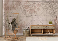 Wall mural with old-world map and greenery

