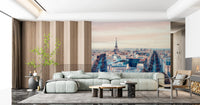 Eiffel Tower View wallpaper mural of the Paris rooftops beside a sage sectional sofa and wood slat wall in a living room