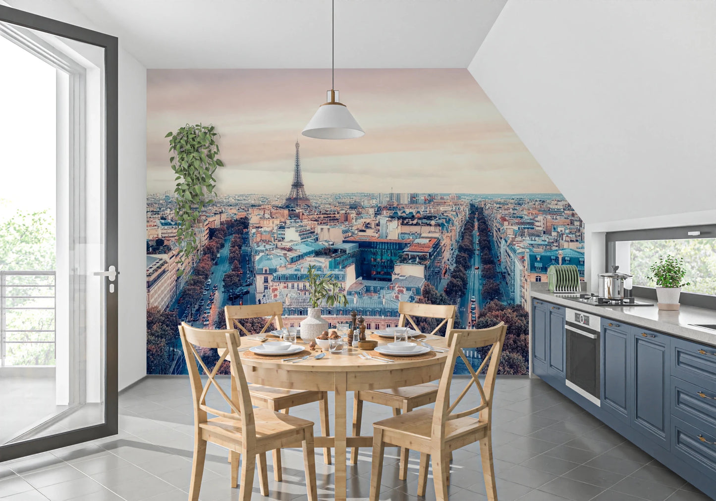 Eiffel Tower View wallpaper mural with the Paris skyline above a round wood dining table and blue kitchen cabinets