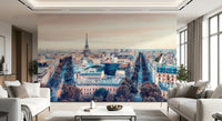 Eiffel Tower View wallpaper mural of the wide Paris skyline between two facing cream sofas in a bright living room