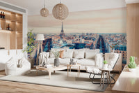 Eiffel Tower View wallpaper mural showing the tower and Paris rooftops behind a white sofa and tripod lamp in a living room