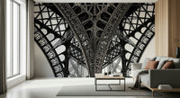 Modern bedroom with Eiffel wallpaper mural, muted tones, cityscape behind bed