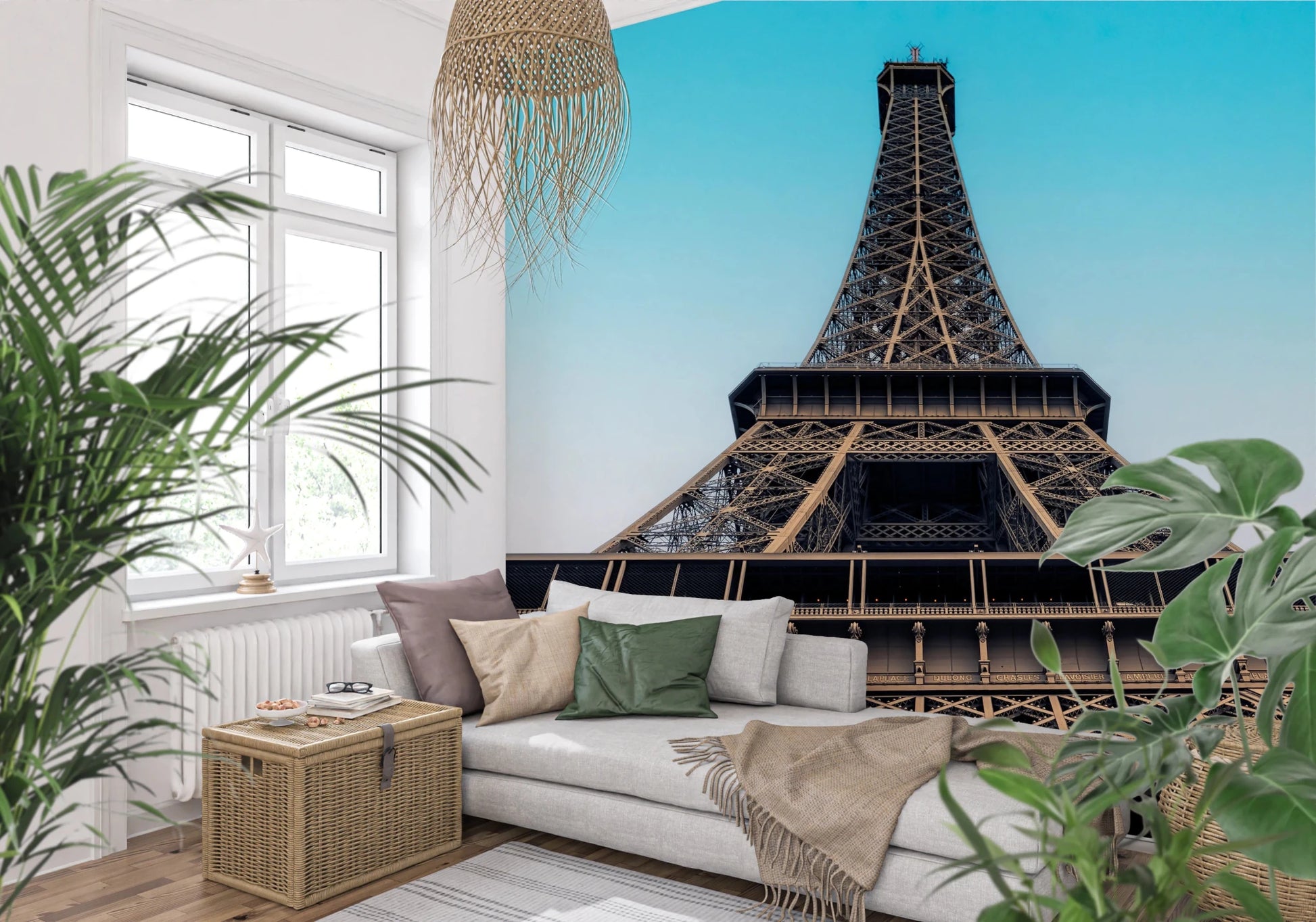 Eiffel's Azure Ascent wallpaper mural with the Eiffel Tower behind a white sofa among leafy plants in a living room