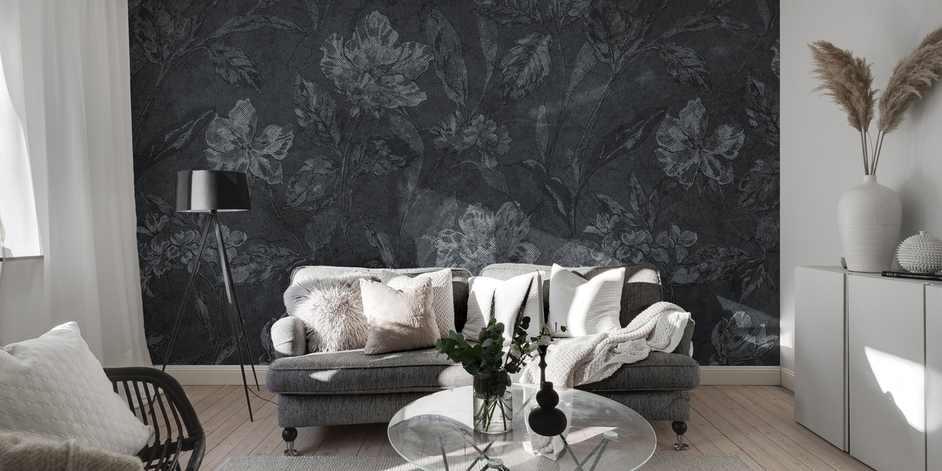 Black floral wallpaper mural installed on a living room feature wall, showing large, intricate white and pink blooms for a dramatic, luxurious effect.