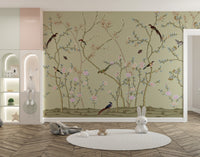 Vibrant tropical bird wallpaper mural with lush green garden foliage.