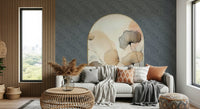 Elegant Floral Archway wallpaper mural on a navy wall behind a grey sofa with wood slats and a city window view