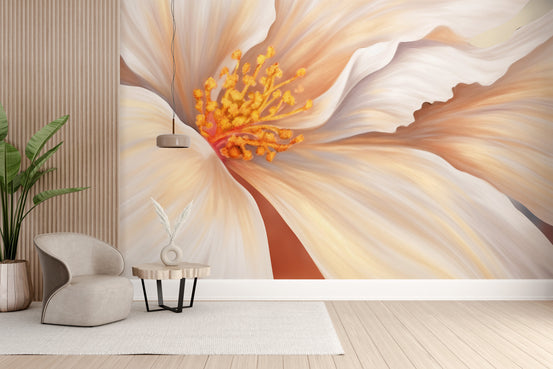 Elegant oversized floral wall mural with a cream hibiscus bloom behind a beige armchair in a living room