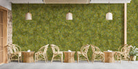Embroidery Moss Green Color wallpaper mural as a textured green wall in a cafe with rattan chairs and woven pendant lights