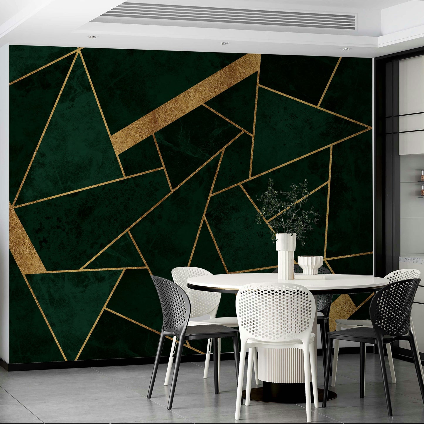 An artistic gold and emerald mural on minimalist wallpaper.

