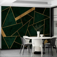 An artistic gold and emerald mural on minimalist wallpaper.

