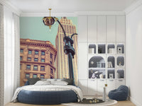 Street level New York landmark majesty mural, classic lamps visible.